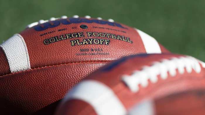 College Football Playoff wording is seen on a football